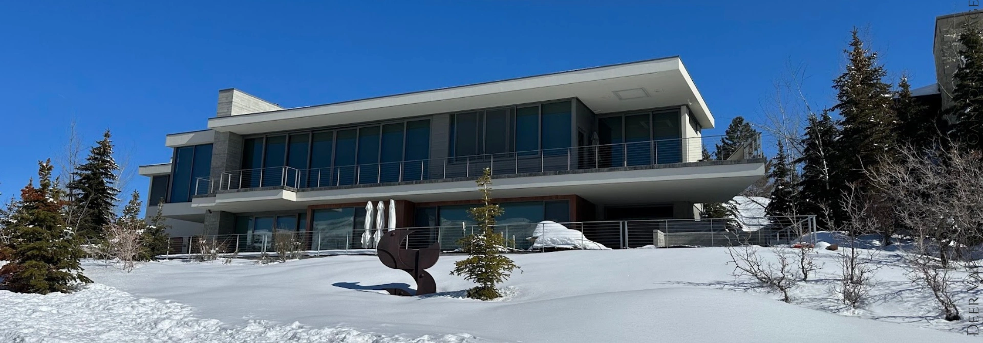 Stunning modern architecture nestled in April Mountain, Park City, with a backdrop of pristine snow-covered landscapes